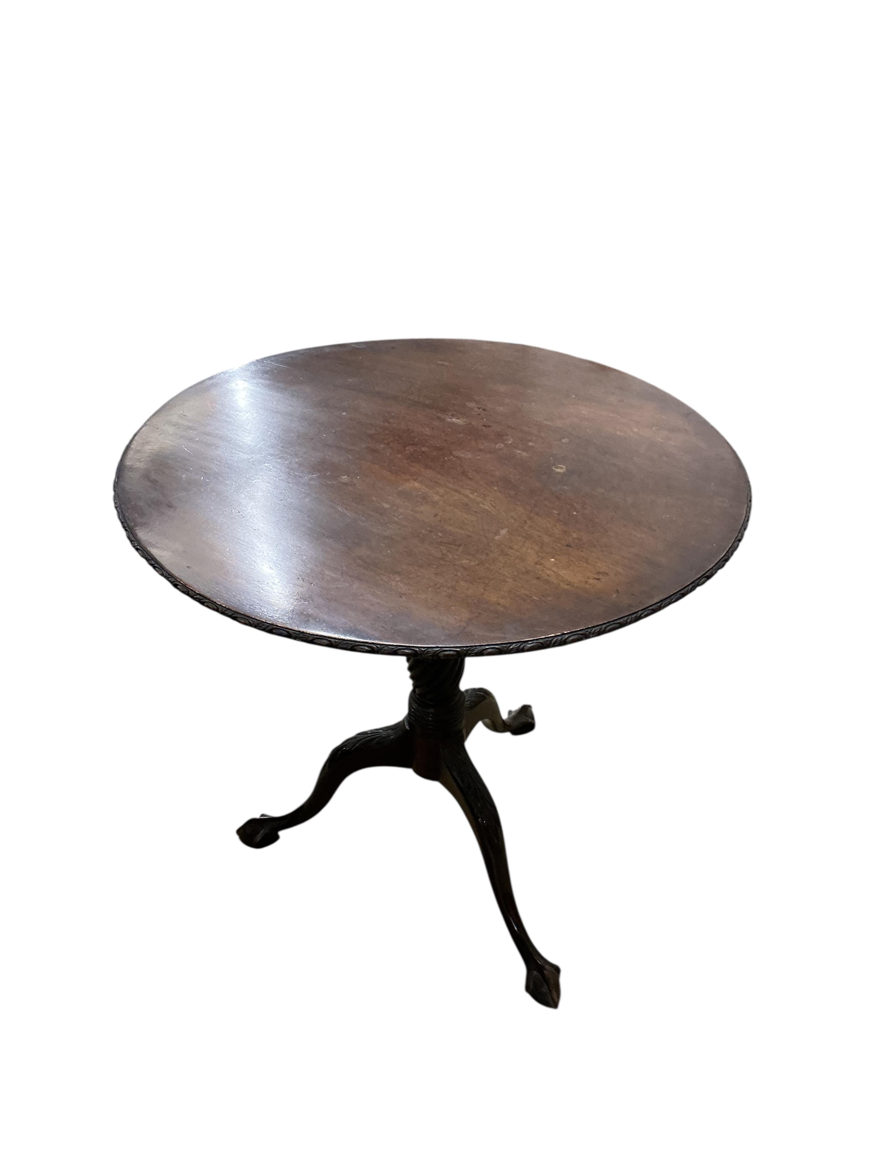 A George III style circular mahogany tilt top tripod tea table, diameter 74cm, height 70cm